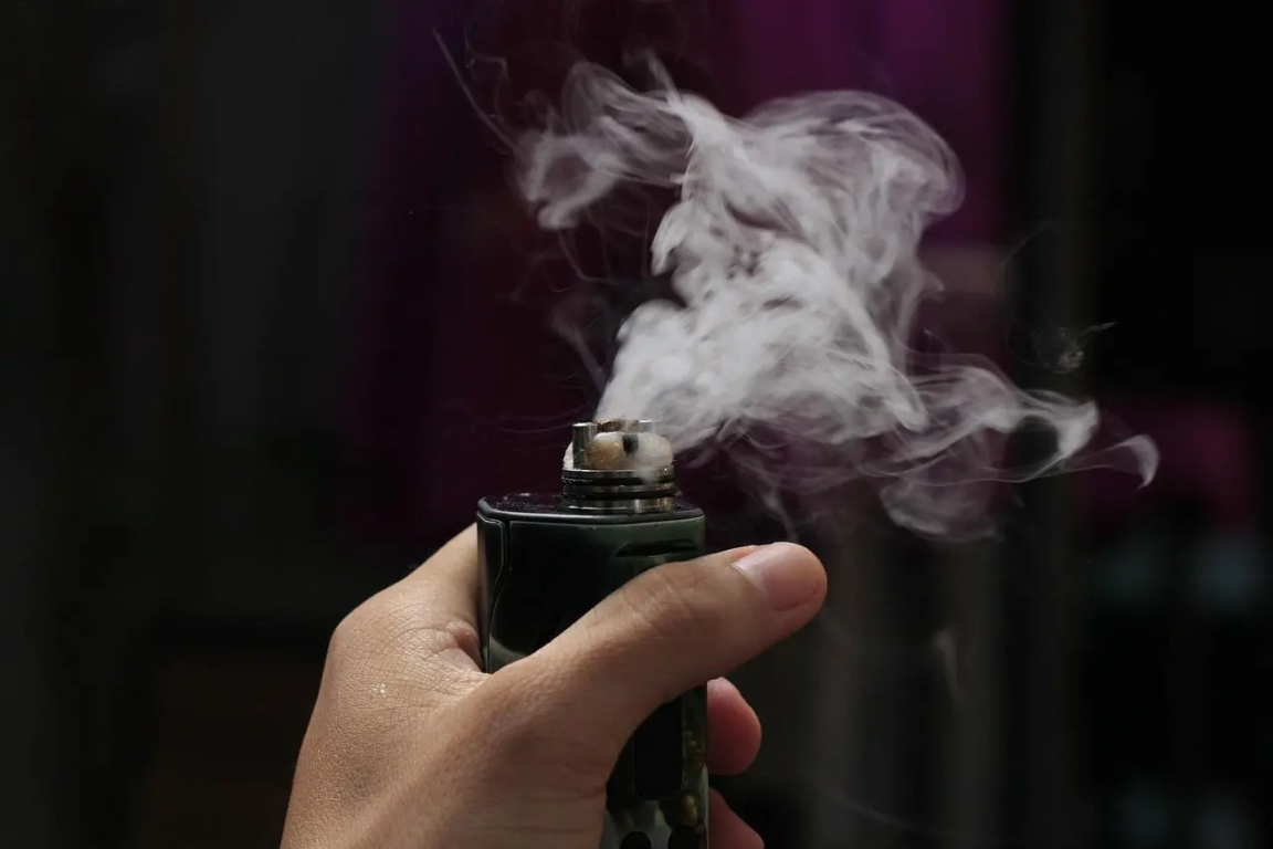 Vape device releasing smoke